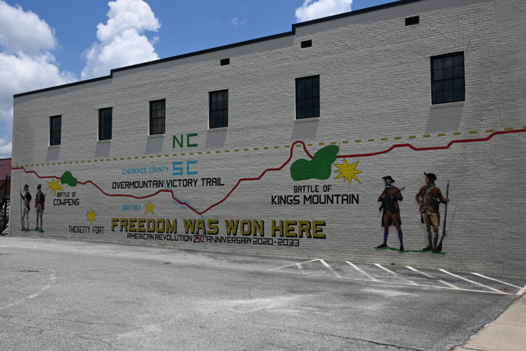 A unique experience mural on one of the buildings in downtown Gaffney, showing that Gaffney sits in the middle of a two National Rev War Parks.